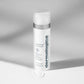 Ein Fläschchen PowerBright Dark Spot Serum + PowerBright Moisturizer SPF50 steht aufrecht auf einer hellen Fläche, mit einem Tupfer daneben - perfekt für die gezielte Behandlung von Hyperpigmentierung und die Verbesserung Ihrer Dark Spot Routine.